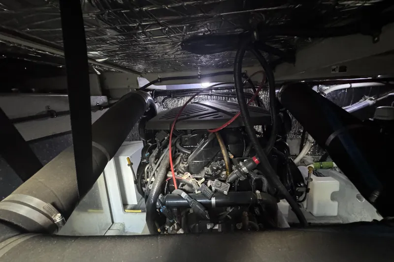 Slide: The Image of Engine room of a 2003 Meridian 411 Sedan yacht, showcasing mechanical components. - 34