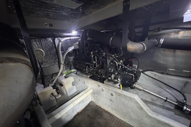 Slide: The Image of Engine room of a 2003 Meridian 411 Sedan, showcasing mechanical components and wiring. - 36
