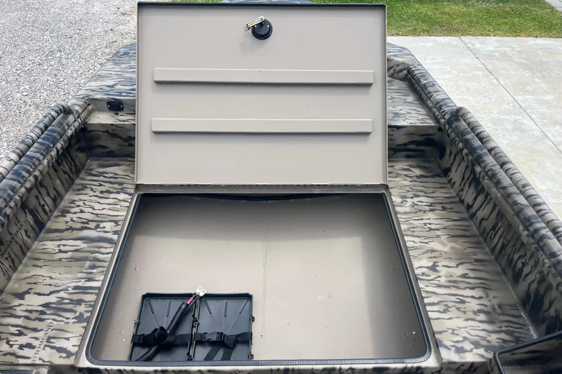 Slide: The Image of Open storage compartment on Excel 1854 F4 Pro boat, 2026 model, with camouflage pattern. - 10