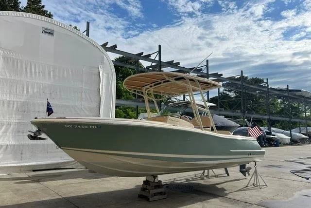 The Image of 2015 Chris-Craft Catalina 23 boat on display under a partly cloudy sky. - 0