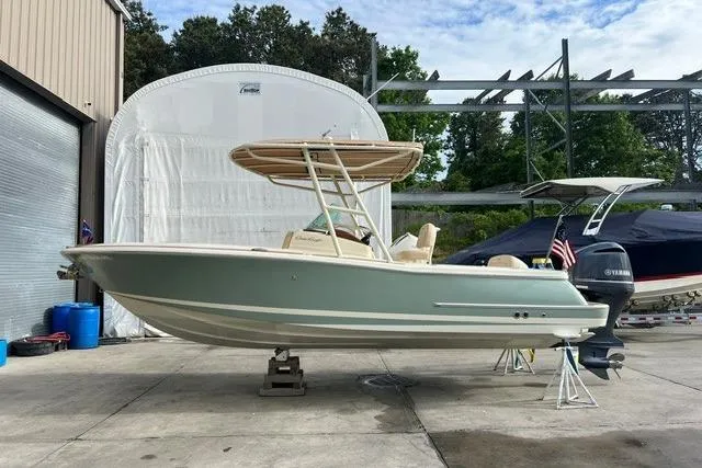 Slide: The Image of 2015 Chris-Craft Catalina 23 boat on display in a marina setting. - 1