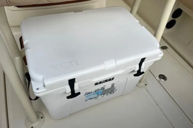Slide: The Image of White YETI cooler on 2015 Chris-Craft Catalina 23 boat deck. - 12