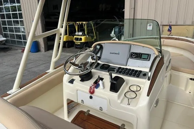 Slide: The Image of 2015 Chris-Craft Catalina 23 boat dashboard with Garmin navigation system. - 13
