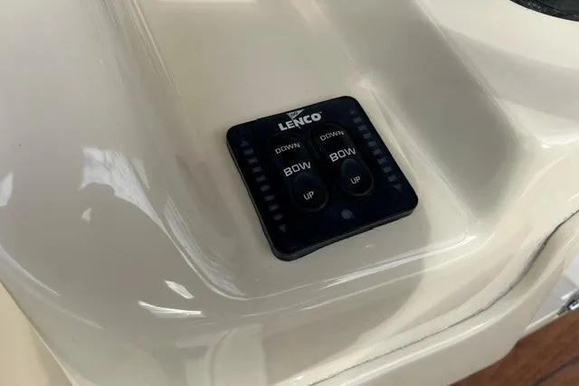 Slide: The Image of Control panel on 2015 Chris-Craft Catalina 23 boat with Lenco trim tab switches. - 17