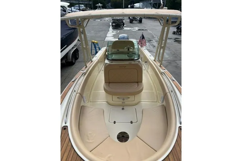 Slide: The Image of 2015 Chris-Craft Catalina 23 boat interior with seating and American flag. - 23