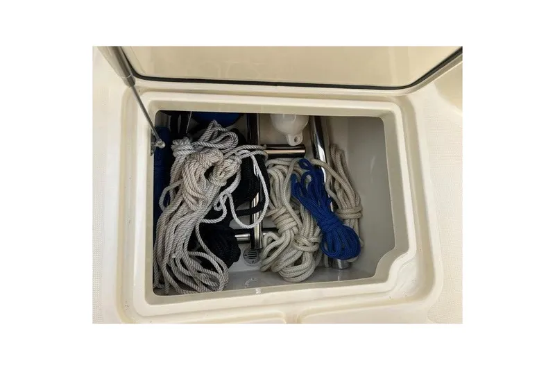 Slide: The Image of Storage compartment with ropes on a 2015 Chris-Craft Catalina 23 boat. - 26