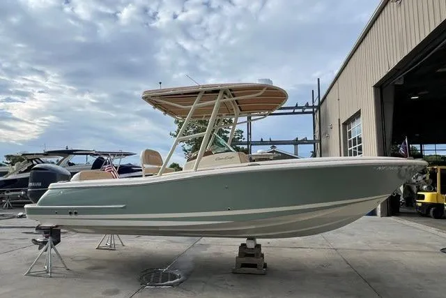 Slide: The Image of 2015 Chris-Craft Catalina 23 boat on display outside a warehouse. - 5