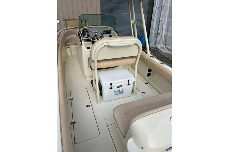 Slide: The Image of 2015 Chris-Craft Catalina 23 boat interior with seating and steering console. - 9