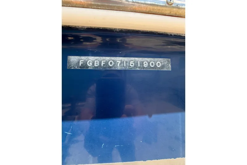 Slide: The Image of 2000 Chaparral Signature 240 boat hull identification number (HIN) on blue surface. - 13