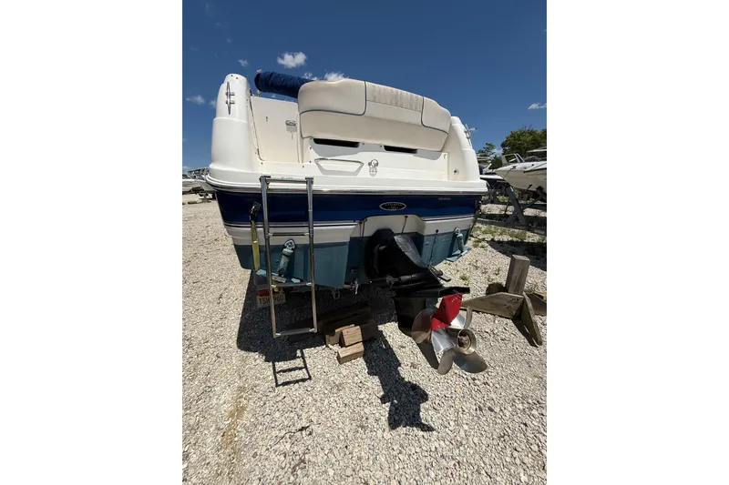 Slide: The Image of 2000 Chaparral Signature 240 boat rear view with propeller and ladder. - 15