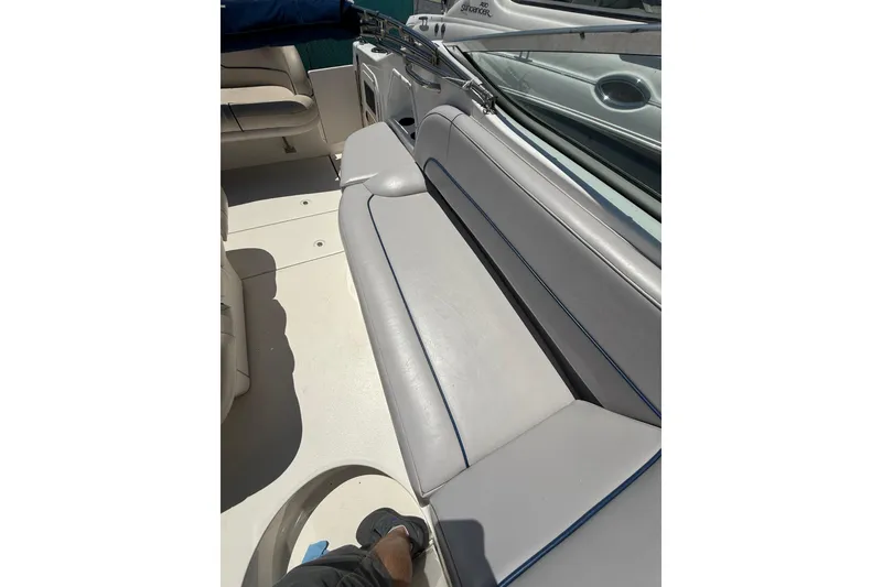 Slide: The Image of 2000 Chaparral Signature 240 boat interior with gray seating and blue accents. - 17