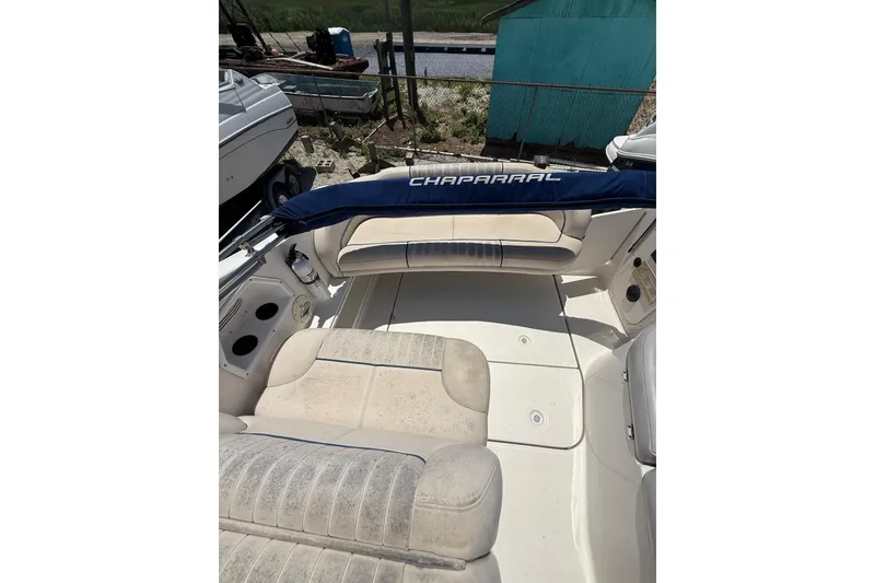 Slide: The Image of 2000 Chaparral Signature 240 boat interior with seating and storage compartments. - 19