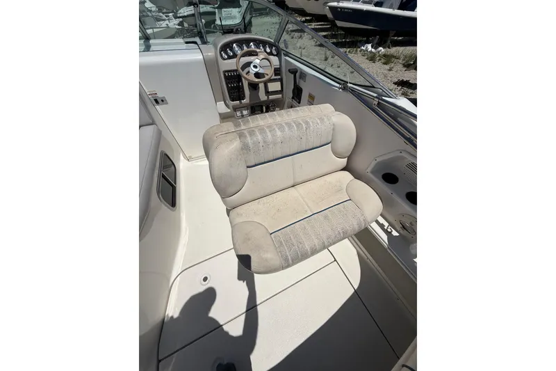 Slide: The Image of 2000 Chaparral Signature 240 boat interior with steering wheel and seating. - 20