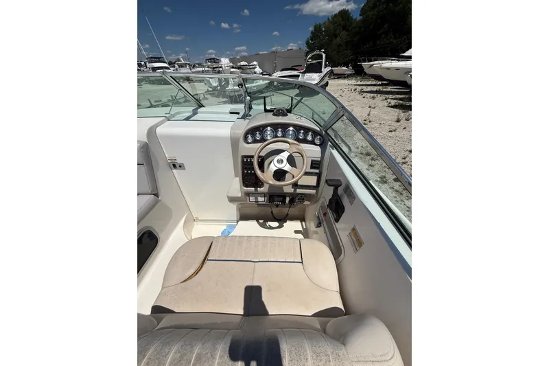 Slide: The Image of 2000 Chaparral Signature 240 boat cockpit with steering wheel and dashboard controls. - 21