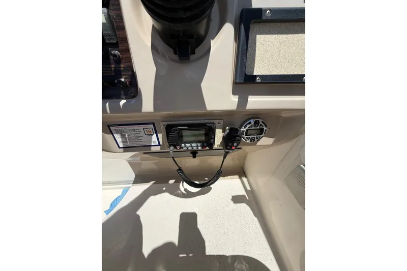Slide: The Image of Control panel of a 2000 Chaparral Signature 240 boat with radio and speaker. - 24