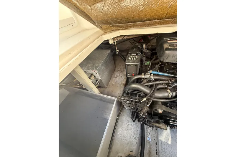Slide: The Image of Engine compartment of a 2000 Chaparral Signature 240 boat, showcasing mechanical components. - 28