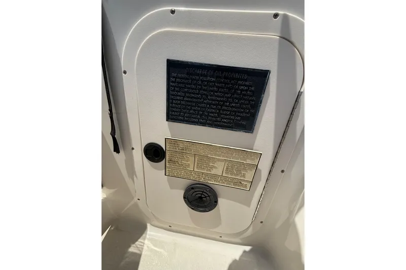 Slide: The Image of 2000 Chaparral Signature 240 boat interior with safety and compliance plaques. - 31