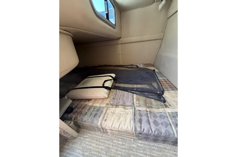 Slide: The Image of Interior cabin of 2000 Chaparral Signature 240 boat with cushions and window. - 42
