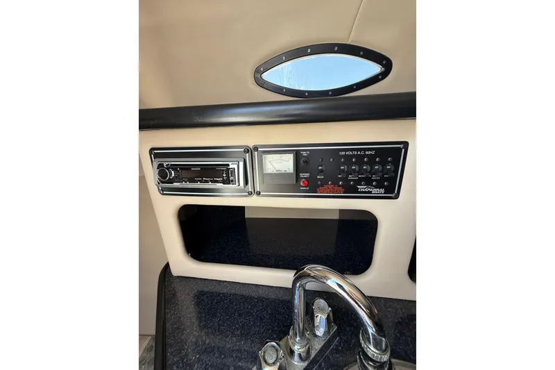 Slide: The Image of Control panel and stereo system in 2000 Chaparral Signature 240 boat interior. - 46