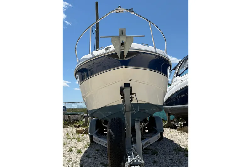 Slide: The Image of Chaparral Signature 240 boat, 2000 model, on trailer under clear blue sky. - 7