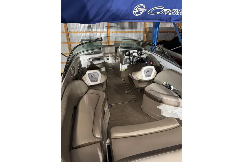 Slide: The Image of Interior view of 2022 Crownline Eclipse E255 boat with seating and steering console. - 21