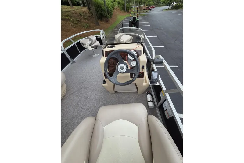 Slide: The Image of 2015 Sun Tracker Bass Buggy 18 DLX pontoon boat interior with steering console. - 3