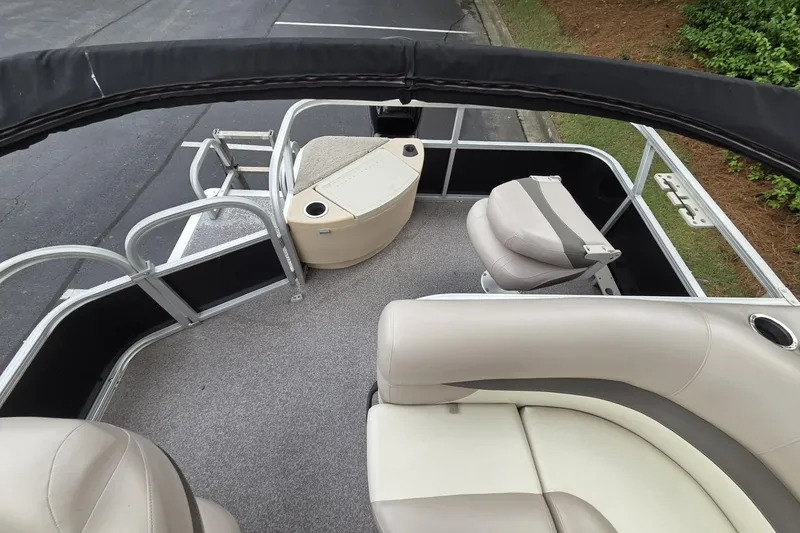 Slide: The Image of 2015 Sun Tracker Bass Buggy 18 DLX interior with seating and railing. - 5