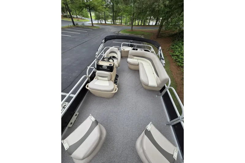 Slide: The Image of 2015 Sun Tracker Bass Buggy 18 DLX pontoon boat with spacious seating and helm. - 6