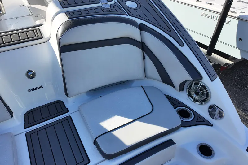 Slide: The Image of 2017 Yamaha Boats 242 Limited S E-Series interior seating with speaker and cup holders. - 10