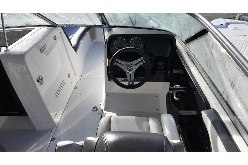 Slide: The Image of 2017 Yamaha Boats 242 Limited S E-Series cockpit with steering wheel and dashboard. - 12