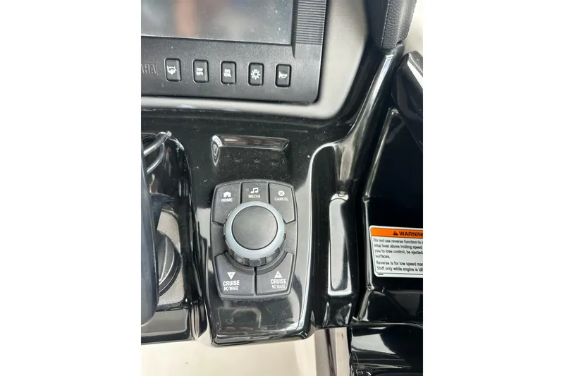 Slide: The Image of Control panel of 2017 Yamaha Boats 242 Limited S E-Series, featuring media and cruise controls. - 14
