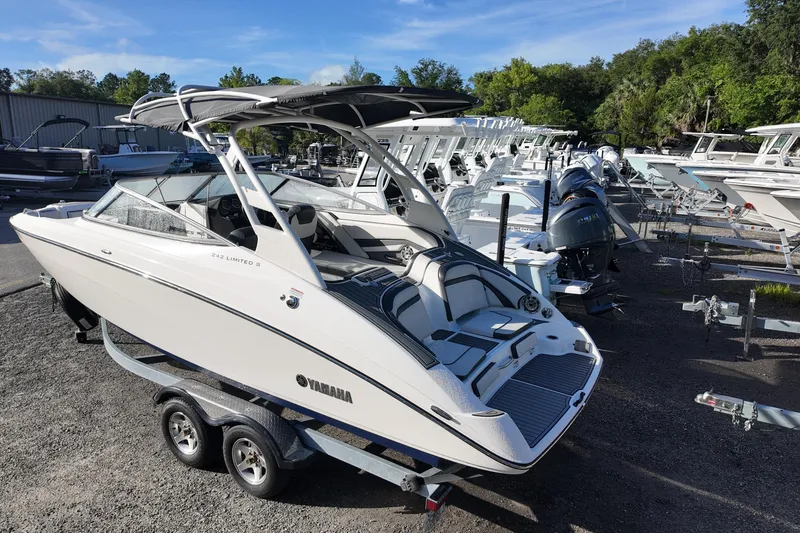 Slide: The Image of 2017 Yamaha Boats 242 Limited S E-Series on trailer in a boatyard. - 2