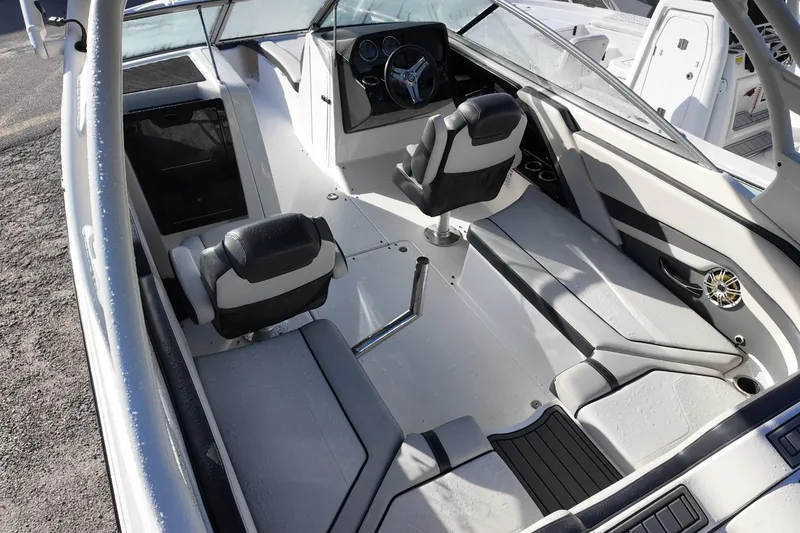 Slide: The Image of 2017 Yamaha Boats 242 Limited S E-Series interior with sleek seating and modern dashboard. - 4