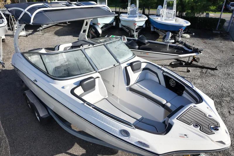 Slide: The Image of 2017 Yamaha Boats 242 Limited S E-Series, sleek design, parked on trailer. - 6