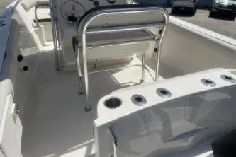 Slide: The Image of 2022 Sailfish 242 CC boat interior with seating and rod holders. - 7