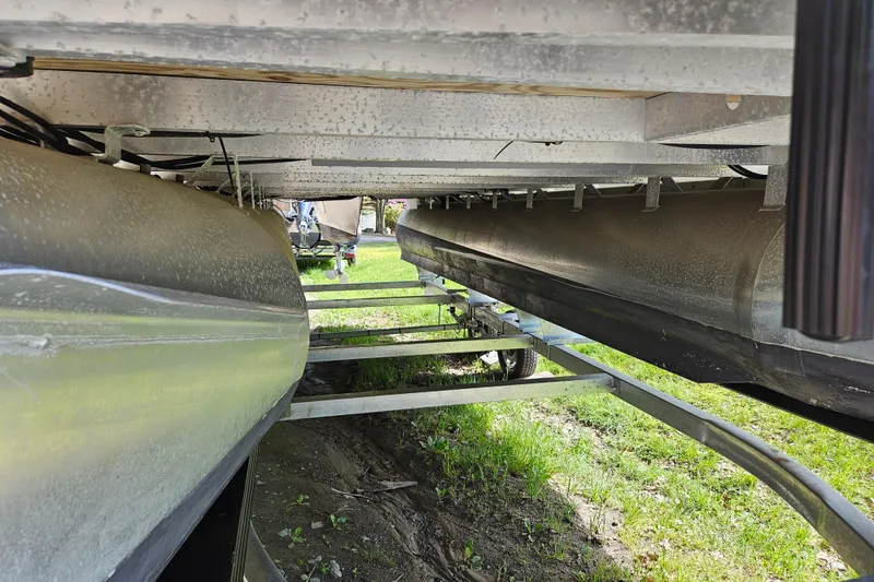 Slide: The Image of Underneath view of a 2019 Sweetwater 2086 pontoon boat on a trailer. - 13