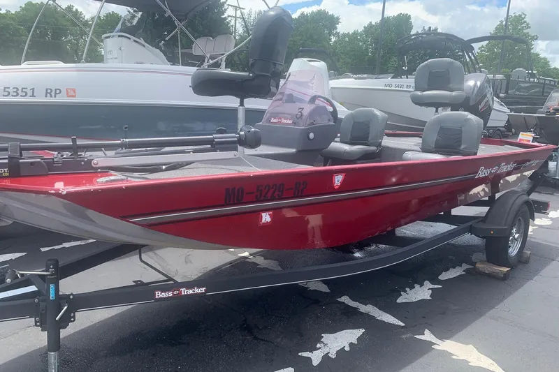 The Image of 2021 Tracker Bass Tracker Classic XL boat in red, parked on a trailer. - 0