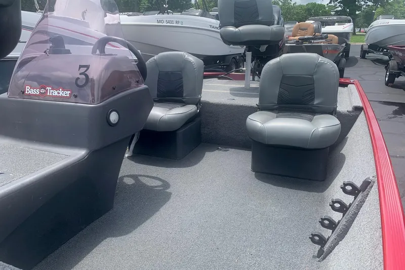 Slide: The Image of 2021 Tracker Bass Tracker Classic XL boat interior with seating and steering console. - 4