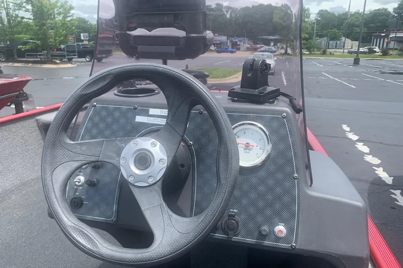 Slide: The Image of Steering console of 2021 Tracker Bass Tracker Classic XL boat in parking lot. - 5