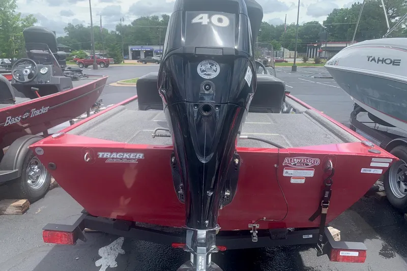 Slide: The Image of 2021 Tracker Bass Tracker Classic XL boat with 40 HP engine, parked outdoors. - 6
