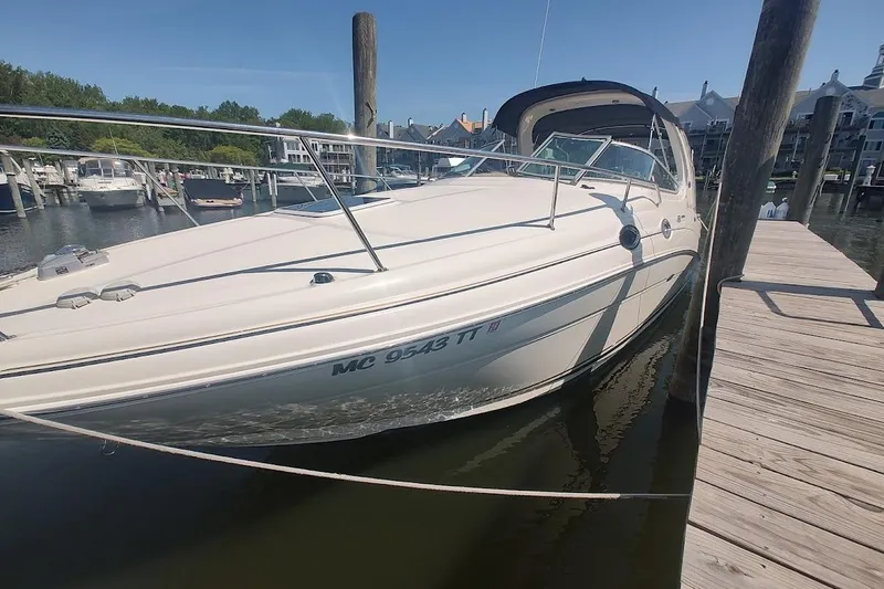 The Image of 2003 Sea Ray Sundancer 280 docked at a marina on a sunny day. - 0