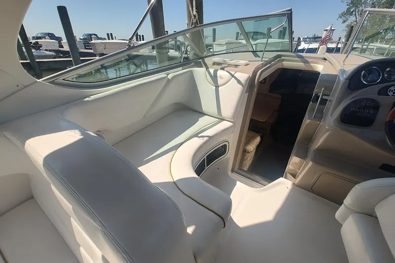 Slide: The Image of Interior view of 2003 Sea Ray Sundancer 280 boat with seating and dashboard. - 12