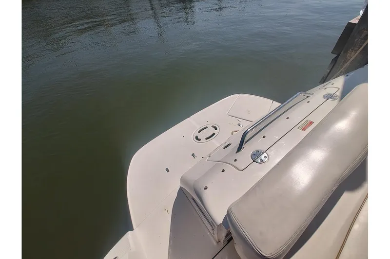 Slide: The Image of 2003 Sea Ray Sundancer 280 swim platform and seating by the water. - 16
