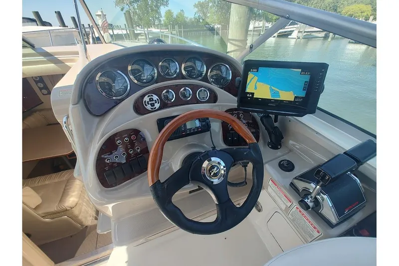 Slide: The Image of Helm of 2003 Sea Ray Sundancer 280 with navigation system and gauges. - 21