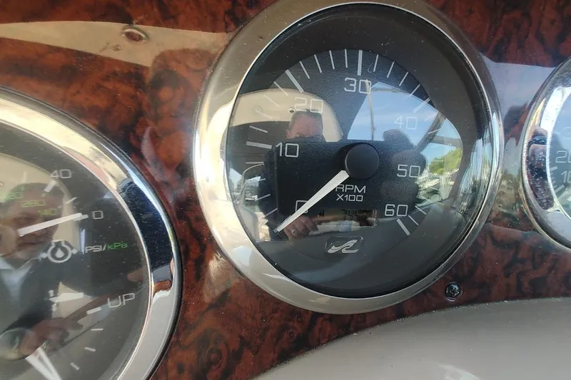 Slide: The Image of Close-up of 2003 Sea Ray Sundancer 280 dashboard gauges, showing RPM and pressure. - 22