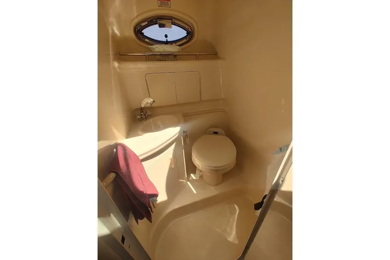 Slide: The Image of Bathroom interior of 2003 Sea Ray Sundancer 280 yacht, featuring compact design and amenities. - 24