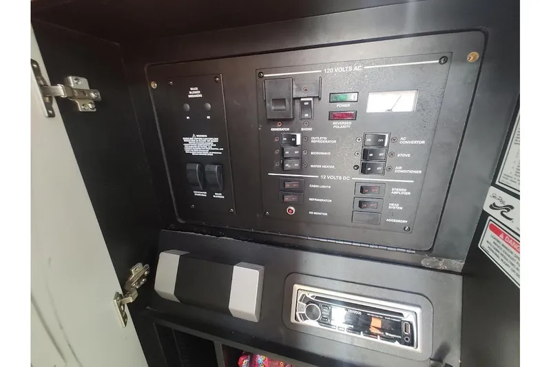 Slide: The Image of Electrical control panel on a 2003 Sea Ray Sundancer 280 boat. - 25