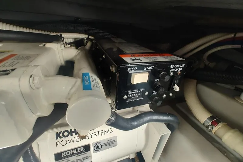 Slide: The Image of Engine compartment of 2003 Sea Ray Sundancer 280 with Kohler power systems. - 29