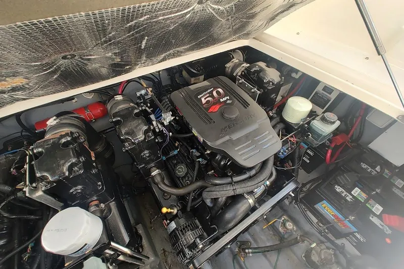 Slide: The Image of Engine compartment of a 2003 Sea Ray Sundancer 280 with Mercury 5.0 MPI engine. - 31