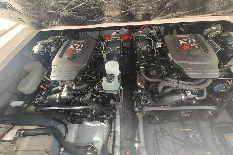 Slide: The Image of Twin MerCruiser 5.0 MPI engines in a 2003 Sea Ray Sundancer 280 boat. - 33